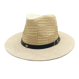 Summer Panama straw sun hat with black band and gold star detail for beach travel