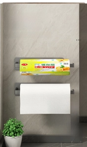 Detail of gunmetal grey wall-mounted kitchen paper roll holder and cling film rack