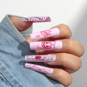 Pink Halloween long coffin press on nails featuring spider webs and pumpkin hand-painted art