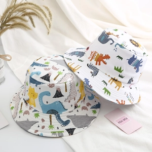 Detail of cotton kids bucket hats with colorful dinosaur and animal print patterns