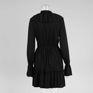 Detail of the black chiffon dress showing back tiered ruffles and flared sleeve design