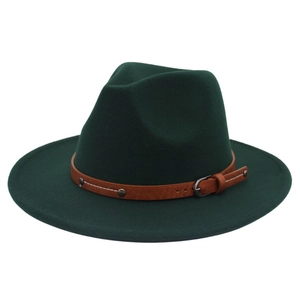 Detail of dark green wool fedora hat featuring a brown leather belt with metal rivets