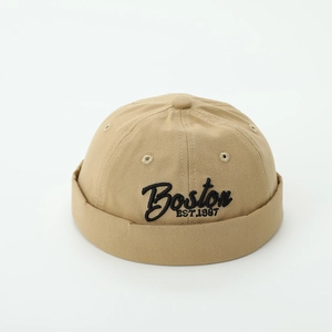 Detail of khaki cotton docker hat featuring black Boston EST.1987 embroidery