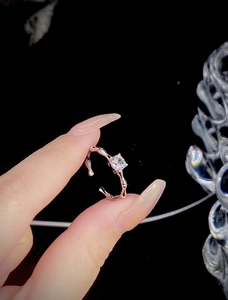 Macro shot of S925 sterling silver ring featuring a square-cut sparkling gemstone
