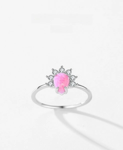 Detail of s925 silver ring featuring a pear-cut pink opal crown with white diamonds