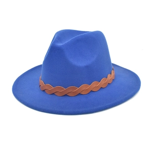 Close-up of a navy wool fedora hat featuring a brown faux leather braided decorative band