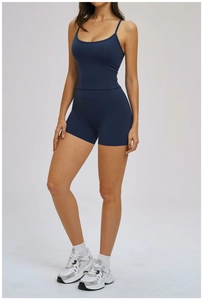 Navy blue women's yoga set with slim strap tank top and high waisted sports shorts