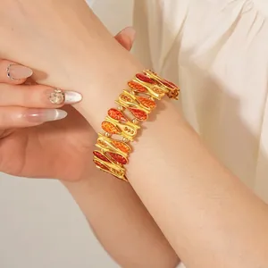 Vintage gold wide chain bracelet with orange enamel segments and sparkling crystals for women