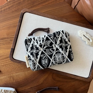 Handmade cotton linen coin purse with white bohemian embroidery and a zipper closure