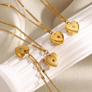 Close-up of heart-shaped 18K gold plated necklaces with colorful zircon gemstones