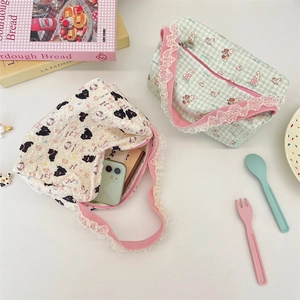 Detail of cartoon canvas tote bags with pink lace trim and animal print patterns