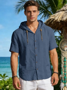 Detail of blue linen hooded shirt featuring natural wood buttons and rustic rope drawstrings