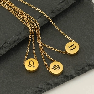 Gold round zodiac pendant necklace set in stainless steel with engraved horoscope symbols