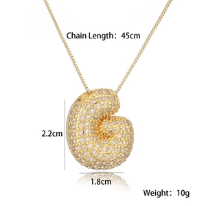 Detailed view of gold plated shell pendant with dimensions 2.2x1.8cm and 45cm chain length