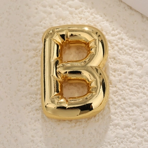 Detail of letter B gold pendant with puffy 3D balloon effect and mirror finish