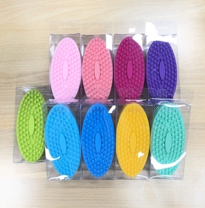 Silicone baby bath brushes in various colors individually packed in clear boxes