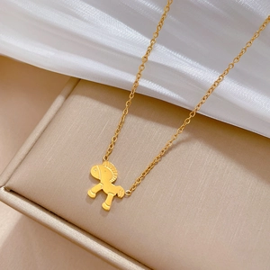 Macro shot of gold pony pendant on O-chain necklace over silk jewelry box