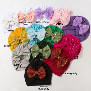 Detail of baby turban hats with large gold-dot bows in thirteen various color options