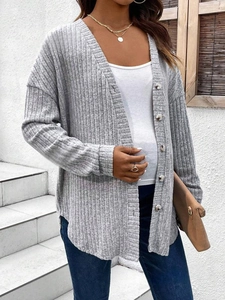 Detail showing the rib-knit texture and five round buttons of this grey maternity cardigan