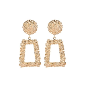 Detailed view of textured gold geometric earrings featuring round discs and rectangular frames