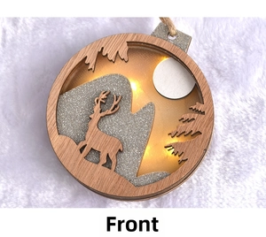 Detail of multi-layer wooden Christmas deer ornament with LED lights and glitter