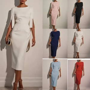 Close-up detail of elegant 3/4 sleeves with pearl embellishments and slit design on dress