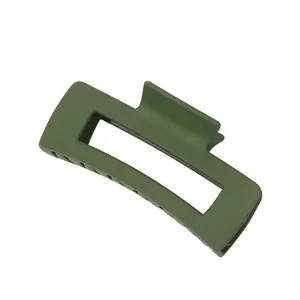 Detail view of large matte olive green rectangular hair claw clip with hollow frame design