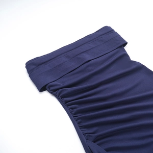 Detail shot of navy blue knitted dress with textured ruching and soft elastic fabric