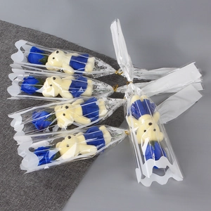 Detailed view of blue soap roses and plush bears in elegant gift packaging for Valentine