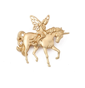 Detailed close-up of a vintage golden baroque brooch featuring a winged fairy on a unicorn