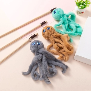 Three plush octopus cat wands with wooden handles in grey, brown and teal colors