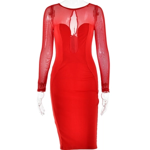 Detail of red crew neck long sleeve dress with sheer mesh paneling and slim fit design