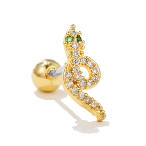 Detalle de pendiente de serpiente dorado con circonitas y ojos verdes