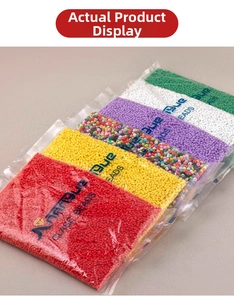 Macro shot of assorted colorful glass beads in transparent bags for DIY jewelry making