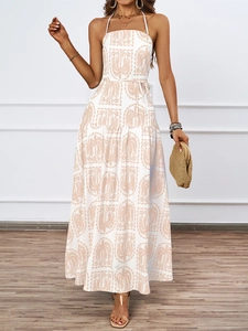Detail of floral halter maxi dress with tiered skirt and tropical palm leaf print