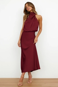 Front view of elegant burgundy satin halter dress with a smooth sleeveless silhouette