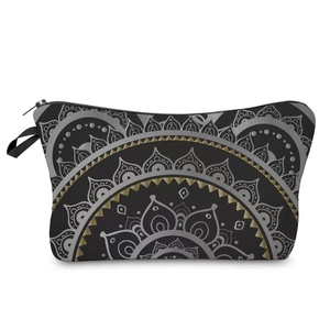 Detailed view of mandala printed black cosmetic bag with gold accents and zipper