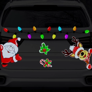 Close-up of festive reflective magnets featuring Santa and Reindeer on a car trunk