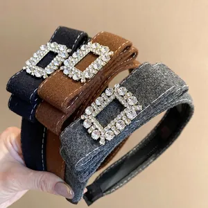 Retro velvet headband with rhinestone buckle available in black, caramel, and grey colors