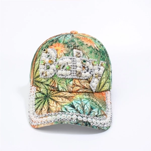 Detailed view of colorful printed baseball cap with rhinestone and pearl Baby letters