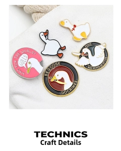 Detailed close-up of cartoon swan enamel pins on canvas with vibrant lacquer finish
