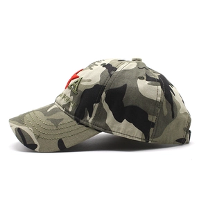 Close-up of jungle camouflage hat featuring detailed letter embroidery and a red star