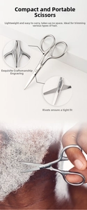 Detail view of engraved metal beard scissors showing precise trimming of grey beard hair