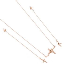 Rose gold lightning bolt and heartbeat wave drop earrings set in stainless steel metal