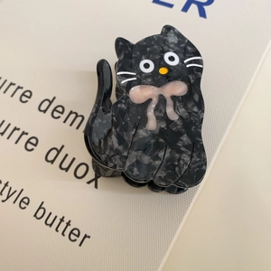 Cute black marble cat hair claw clip with pink bow made of premium acetate