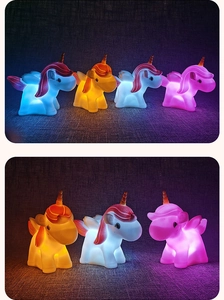 Close-up of multicolor unicorn night lights in blue, pink, and yellow soft silicone