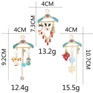 Detail view of enamel Christmas brooches with specific size and weight measurements