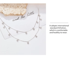 Detailed macro view of 925 sterling silver double layer chain with zircon stones