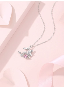 Detail of S925 silver moon and butterfly necklace with pink gemstone and white zircons