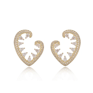 Golden heart earrings with micro-paved zircons and teardrop crystals on white backdrop
